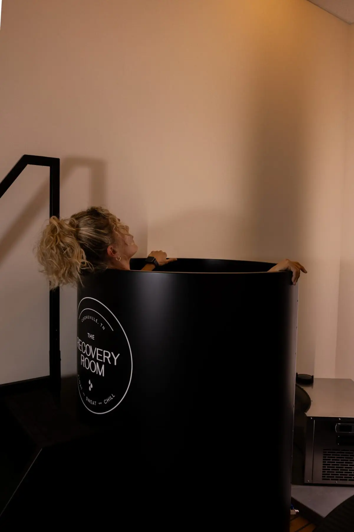 Guest standing in the vertical cold plunge
